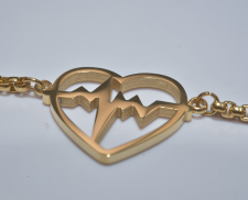 pulsera de acero inoxidable dorada de corazon con pulso 